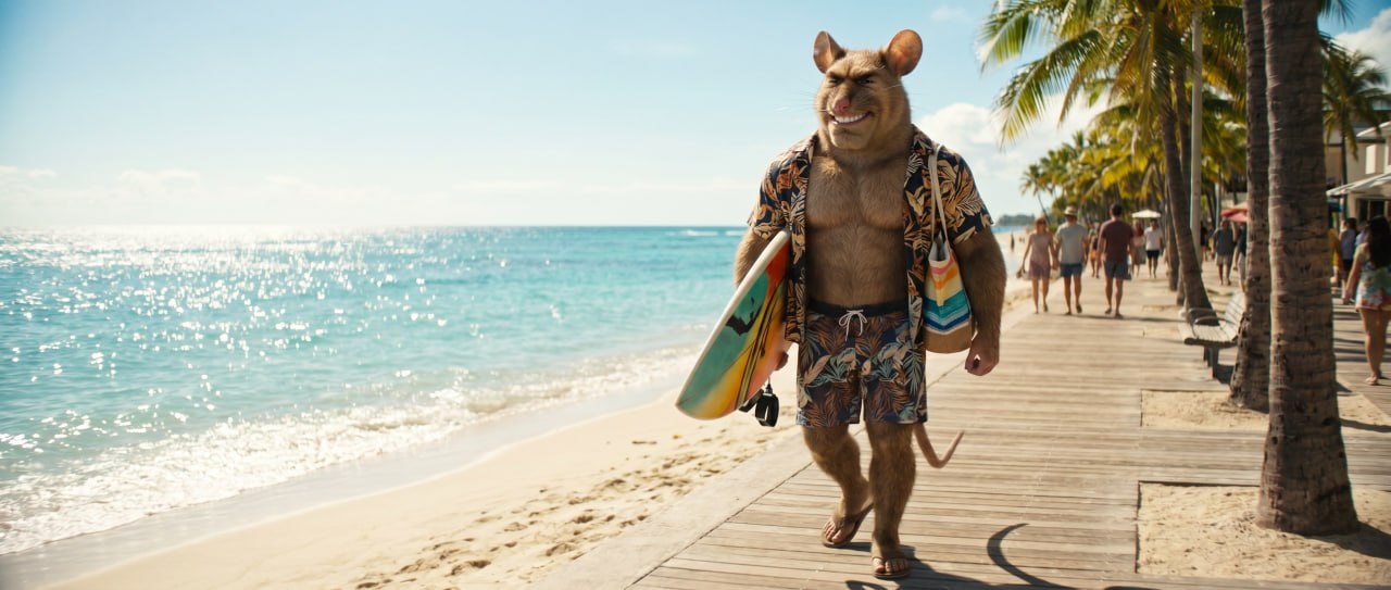 Gigarat walking on a sunny beach with a surfboard